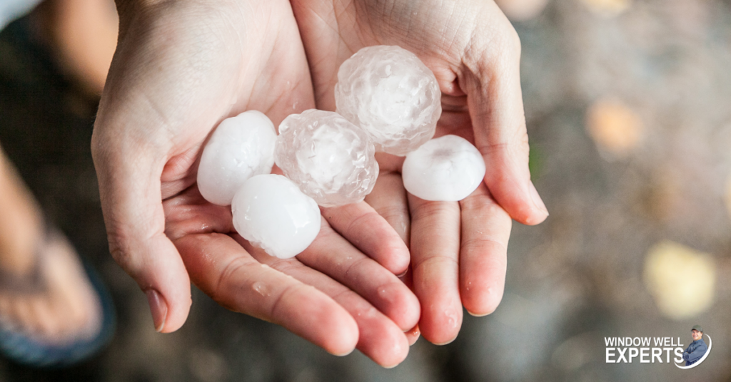 Two hands hold hail balls