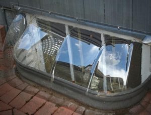 Crystal clear bubble window well cover for elongated wells. Size 44 x 14 x 15.