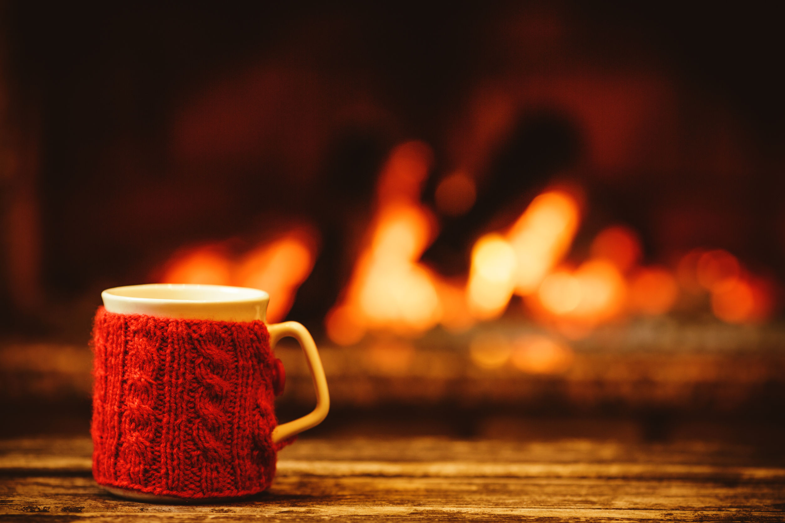 cup in front of fireplace