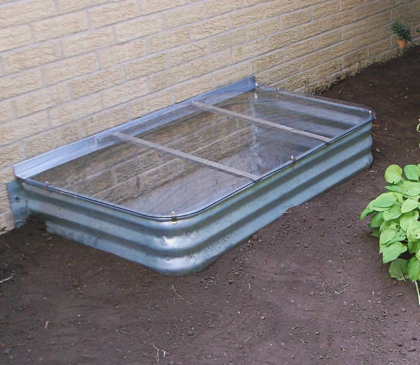 Medium, non-egress metal well with a sloped cover. Size: 50" x 24"