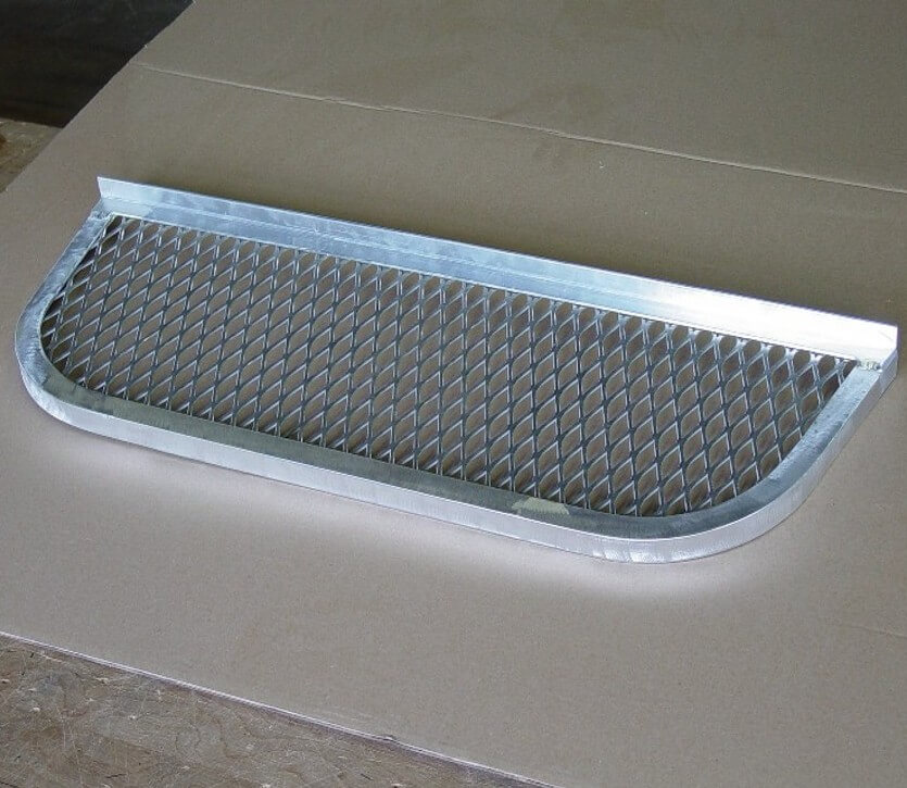 Elongated steel grate with mill finish