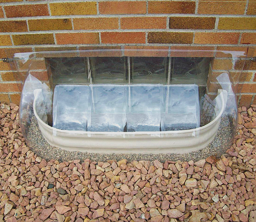 Crystal clear bubble cover with size 43 x 14 x 15, installed on a metal well.