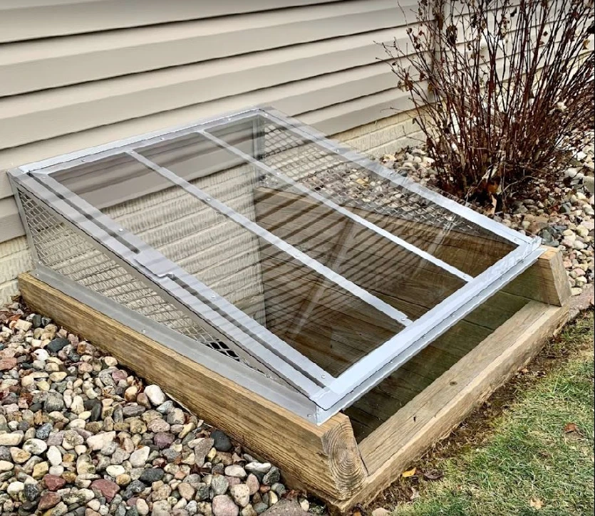 Large egress cover with a super-slant design. It is installed on a timber well and has a plastic front panel.
