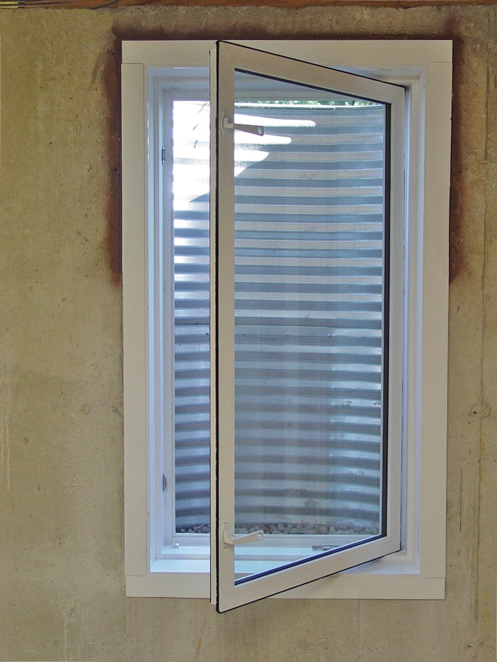 Inward opening casement egress window with galvanized steel window well